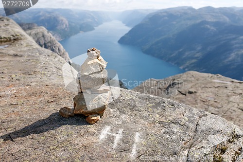 Image of Stack of rocks with mountain and fjord view