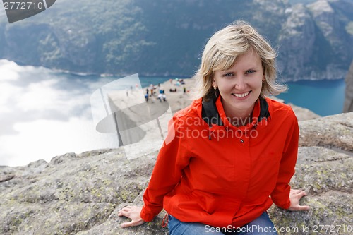 Image of Woman hiker on Pulpit Rock / Preikestolen, Norway