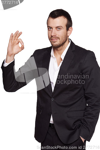 Image of Relaxed fashionable man in suit standing casually