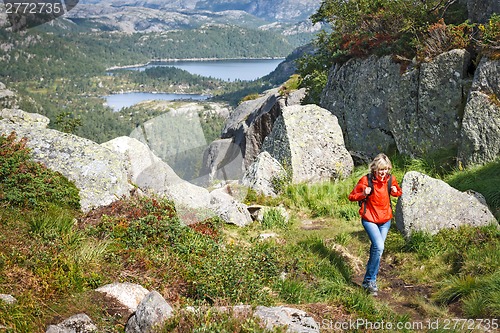 Image of Woman with backpack hiking