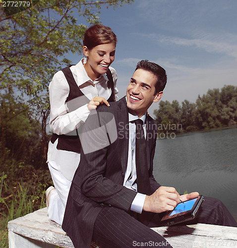 Image of using PDA outdoors yu