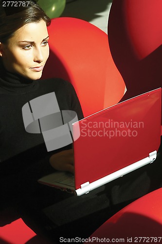 Image of young woman using laptop hukm