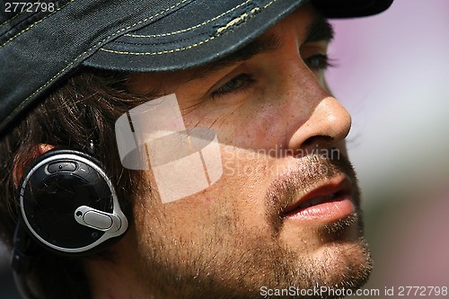 Image of man listening music in headphones 