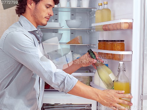 Image of Man near Refrigerator