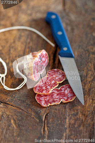 Image of italian salame pressato pressed slicing