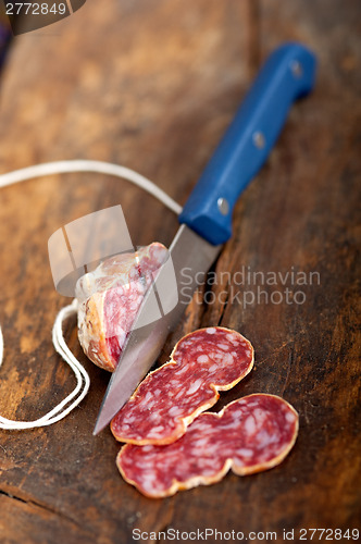 Image of italian salame pressato pressed slicing