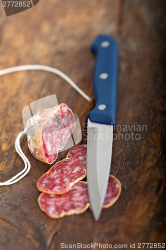 Image of italian salame pressato pressed slicing