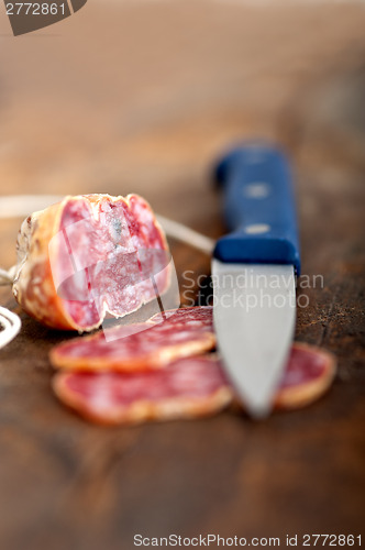 Image of italian salame pressato pressed slicing