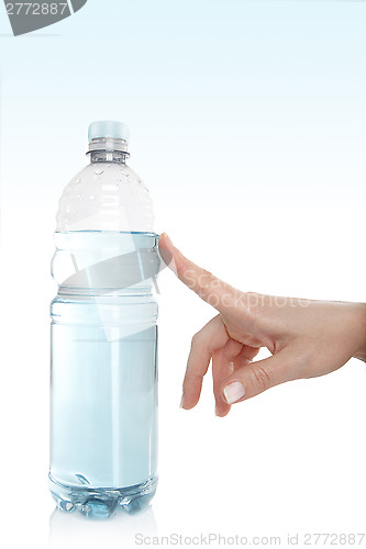 Image of Woman opens a water bottle