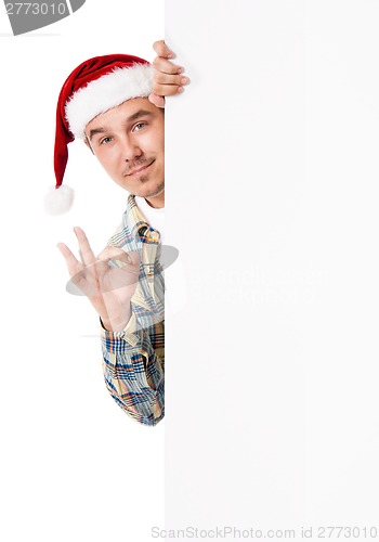 Image of Young man in Santa hat