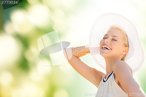 Image of beautiful woman enjoying summer outdoors