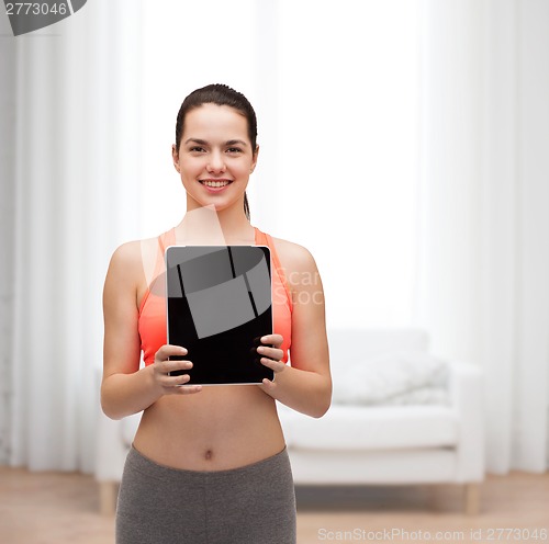 Image of sporty woman with tablet pc blank screen