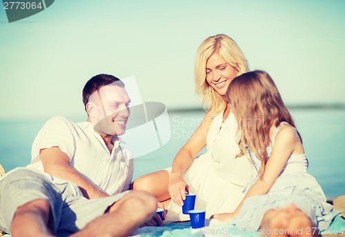 Image of happy family having a picnic