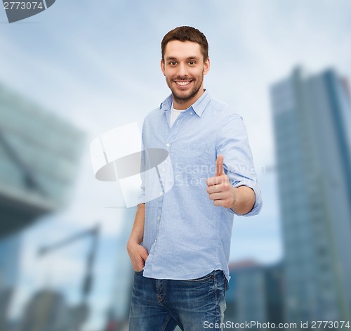 Image of smiling man showing thumbs up