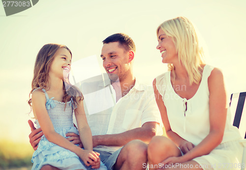 Image of happy family having a picnic