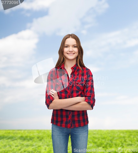 Image of smiling young woman in casual clothes