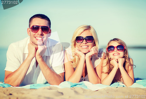 Image of happy family on the beach