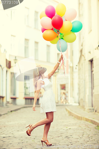 Image of woman with colorful balloons