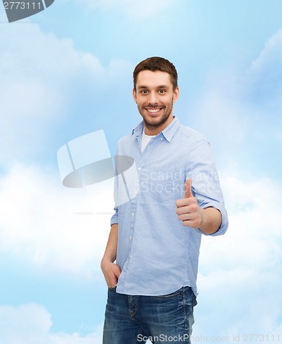 Image of smiling man showing thumbs up