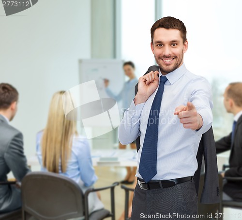 Image of handsome buisnessman with jacket over shoulder