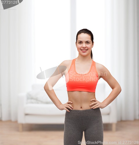 Image of smiling teenage girl in sportswear