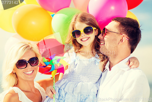 Image of family with colorful balloons