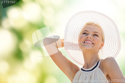 Image of beautiful woman enjoying summer outdoors