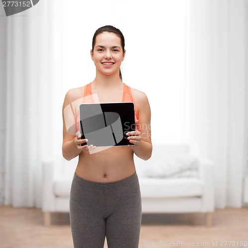 Image of sporty woman with tablet pc blank screen
