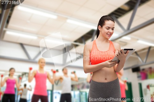 Image of sporty woman with tablet pc computer