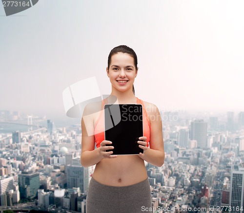 Image of sporty woman with tablet pc blank screen