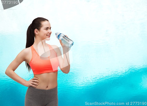 Image of sporty woman with water bottle