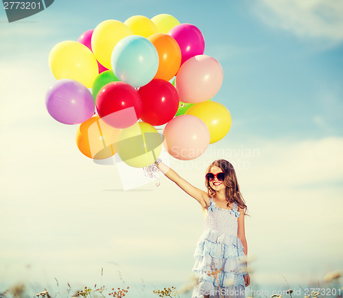 Image of happy girl with colorful balloons