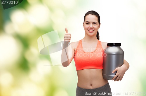 Image of teenage girl with jar of protein showing thumbs up