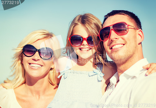 Image of happy family with blue sky