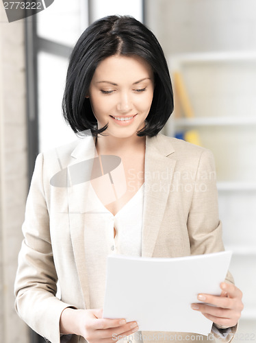 Image of happy woman with documents