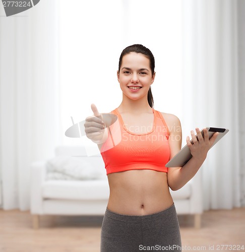 Image of sporty woman with tablet pc computer