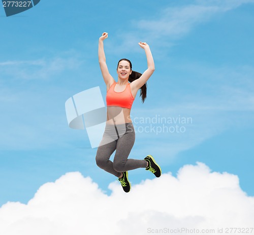 Image of sporty teenage girl jumping in sportswear