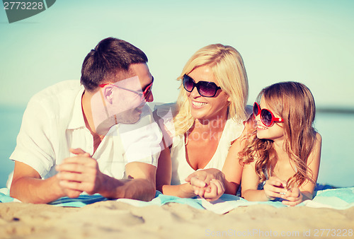 Image of happy family on the beach