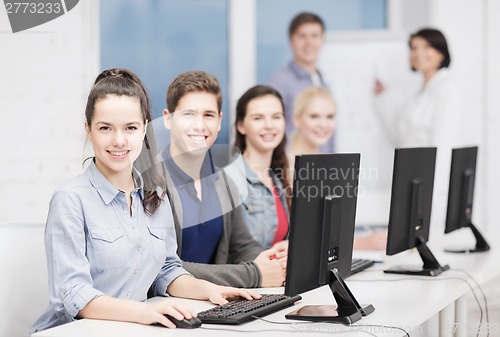 Image of students with computer monitor at school