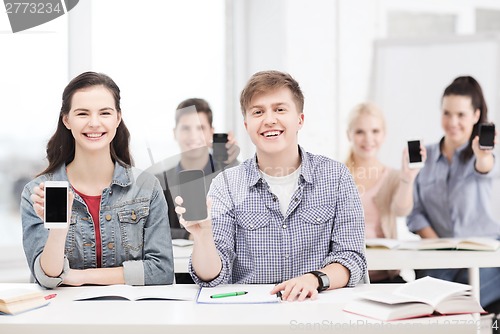 Image of students showing black blank smartphone screens