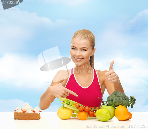 Image of woman pointing at healthy food