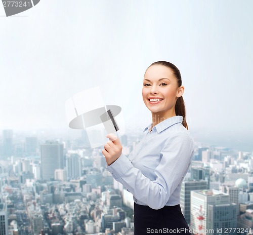 Image of smiling businesswoman showing credit card