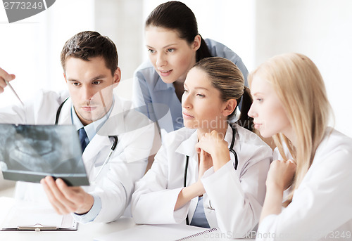 Image of group of doctors looking at x-ray