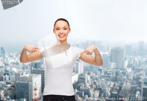 Image of smiling woman in blank white t-shirt