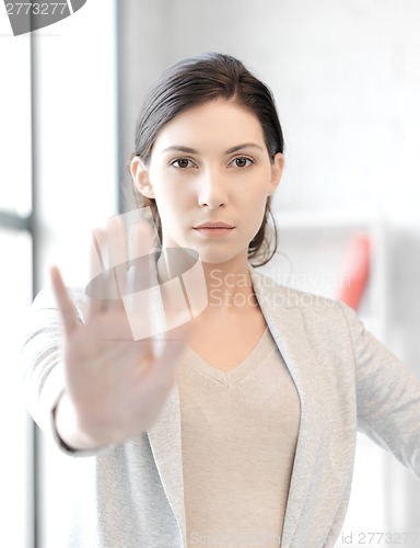 Image of woman making stop gesture