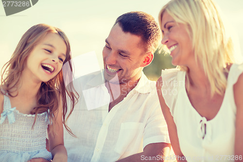 Image of happy family having a picnic