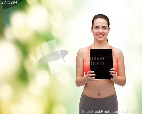 Image of sporty woman with tablet pc blank screen