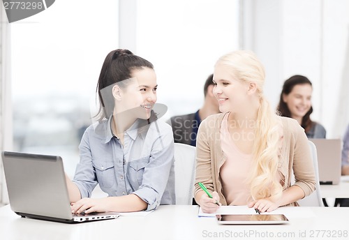 Image of students with laptop, tablet pc and notebooks