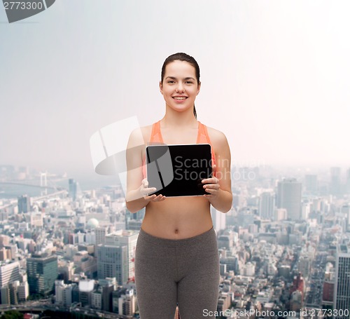 Image of sporty woman with tablet pc blank screen