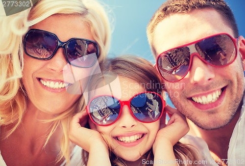 Image of happy family with blue sky